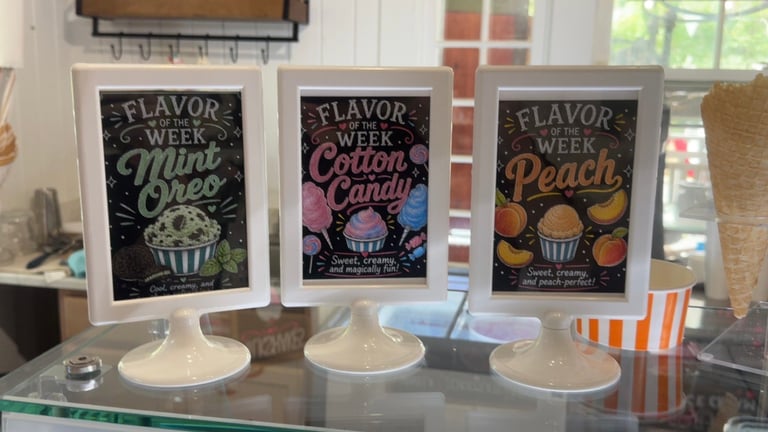 Three flavor week promotional posters for Mint Oreo, Cotton Candy, and Peach displayed above white pedestal samples on a counter.